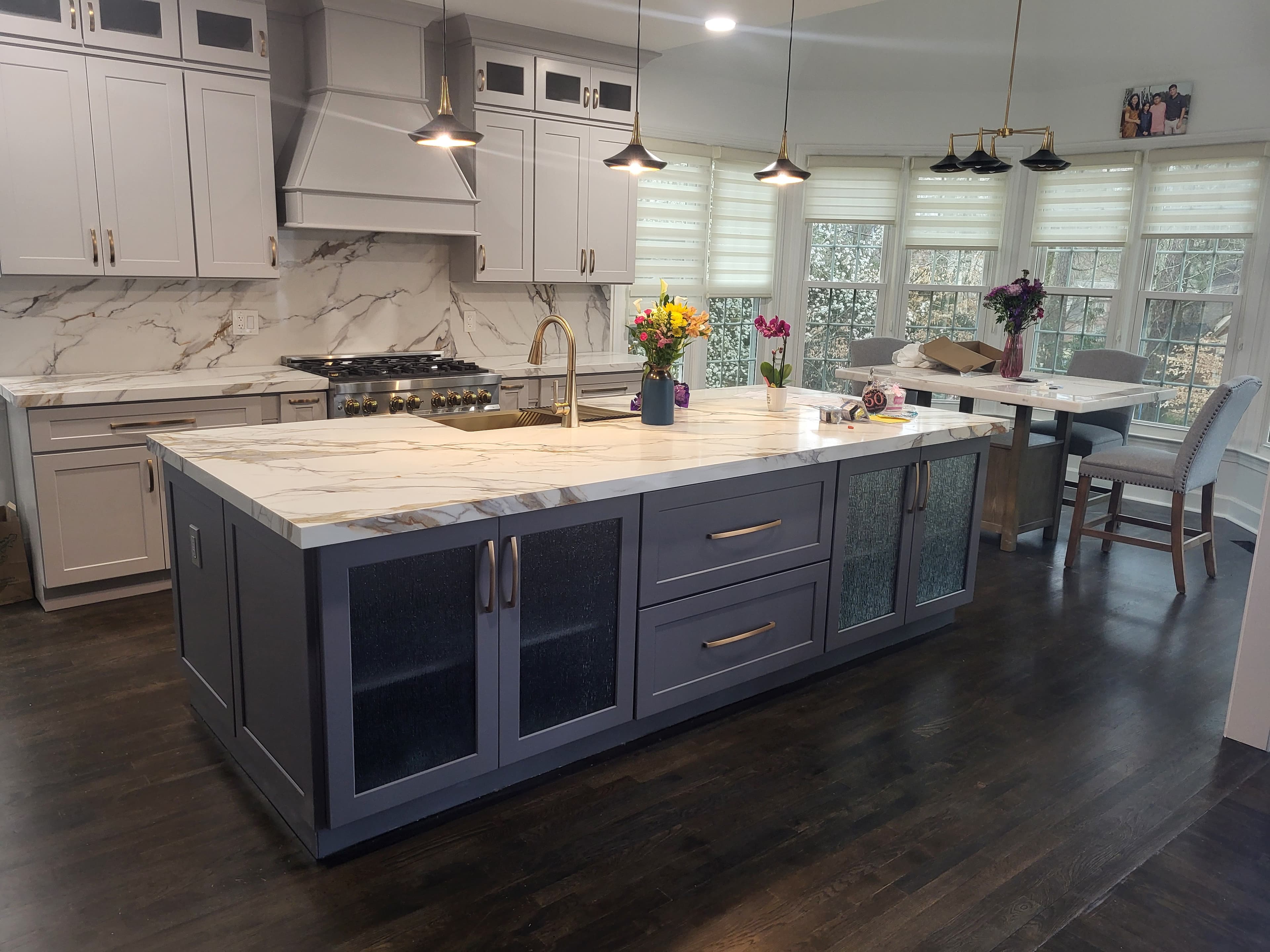 Finished two-tone shaker kitchen — light grey perimeter, dark grey island, gold hardware